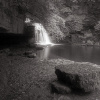 A boulder and cave beside the Cauldron Falls, West Burton, North Yorkshire.