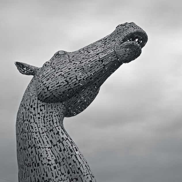 A Kelpie - dramatic square silhouette against the sky
