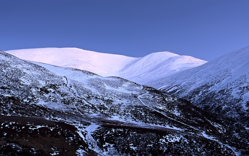 The first star coming out - the snow on Leacann Dubh and Creag Leacach glistening in cold light of winter's dusk.