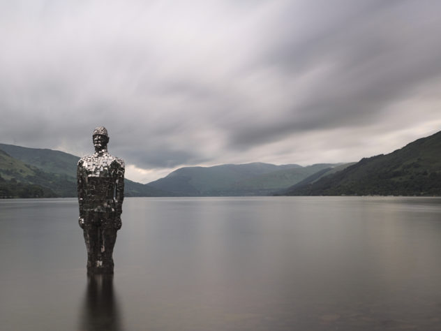A well-known scene: Robert Mulholland's sculpture, 'Still', in the shallows of Loch Earn at St Fillan's. 
It was a dull cloudy day, so no much dramatic light to write home about - but I liked it all the more for being dull and lending itself to long exposures.
