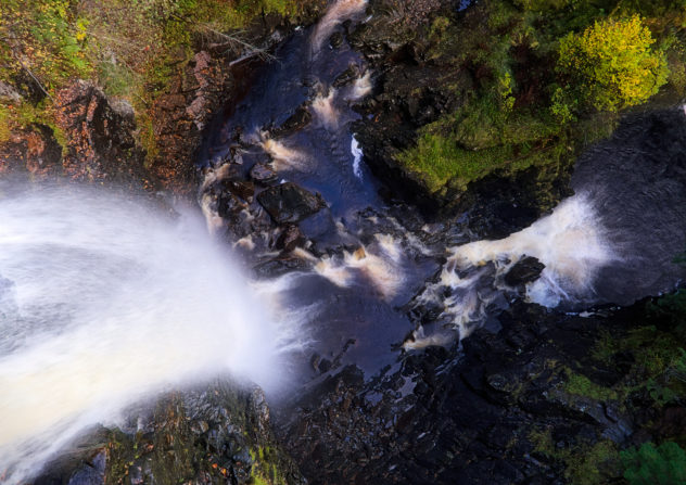 Looking straight down the waterfall at Plodda Falls, river gushing in from the top.