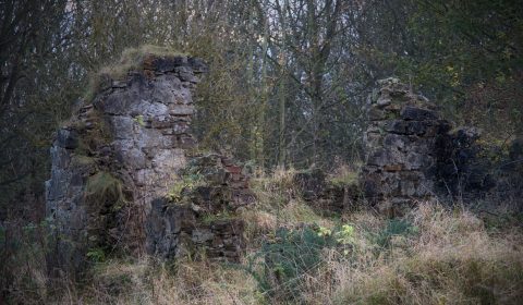 The village of Binnend was located up The Binn, just outsdie Burntisland, providing residence for workers at the local shale oil extraction plant. 
Its last occupant left in 1954; now all that remains are a few fragments of walls and stones in an area barely 30m*30m overgrown with brambles and grass.