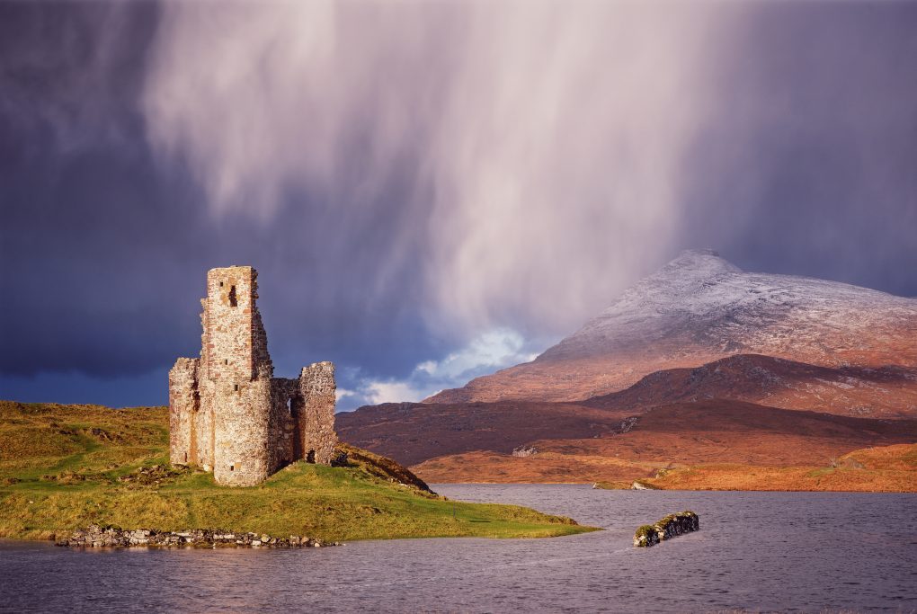 Dramatic precipitation from a passing clouds behind Ardvreck Castle