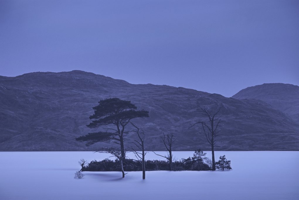 I saw this cluster of trees and small island off the shore of Loch Assynt in passing earlier in the afternoon; by the time I returned it was pitch black night with nothing but a little moonlight to illuminate. A pixel-shift taking the exposure from a base 30s up to 2 minutes made the water silky silvery smooth.